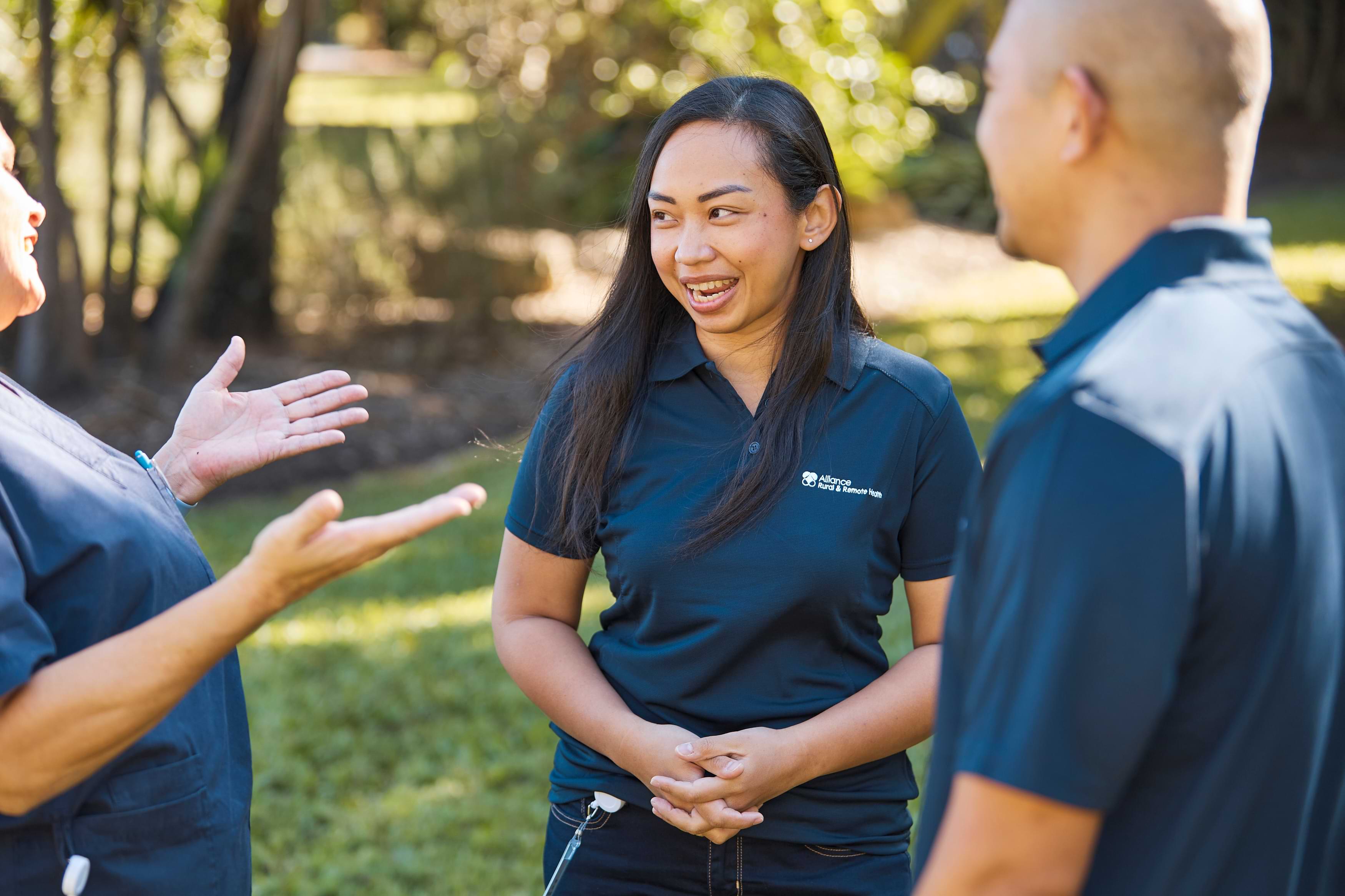 Happy nurses talking in garden