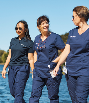 nurses walking by water