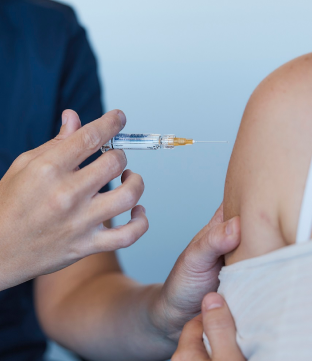 Nurse giving COVID-19 Vaccination